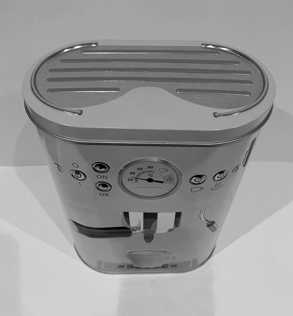 Draufsicht der weißen Vorratsdose im Kaffeemaschinen-Design mit charakteristischen Retro-Elementen.