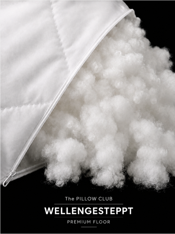 Detailaufnahme der weißen Flockenfüllung im WELLENGESTEPPT Füllkissen von The PILLOW CLUB im PREMIUM FLOOR